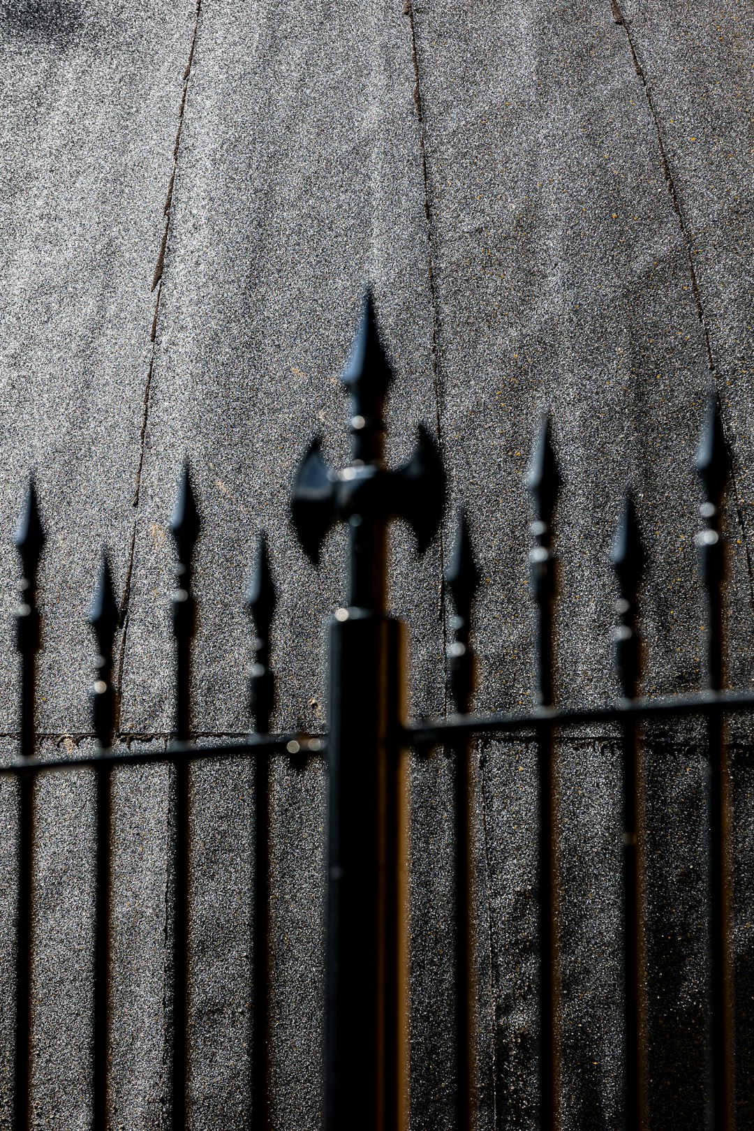about-01 a-dark-metal-fence-with-pointed-finials-7fk-1fqzc4