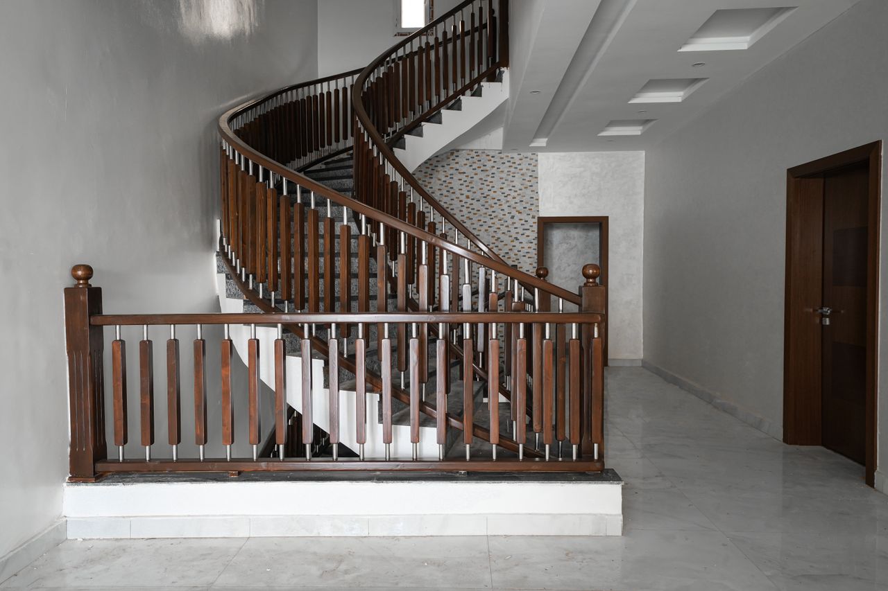 hero-img-02 A stunning spiral staircase in a modern home interior in Nouakchott, showcasing minimalist design.